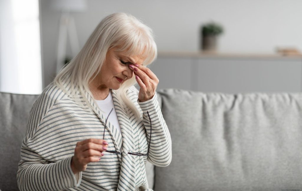 Long COVID woman with a headache